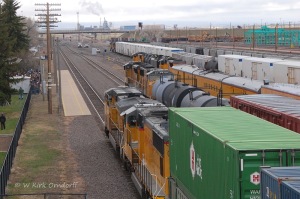 The DPUs of the stack train pass UP 4746 east, next to UP 4014 Big Boy special, with UP 6452 waiting in the yard at Laramie.